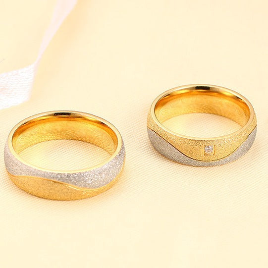 Fashionable titanium steel couple rings with gold inlaid zircon